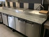 a kitchen with stainless steel appliances and counter tops