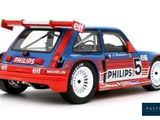 blue and red model of a rally car with a flag on the roof