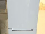 a white refrigerator that is sitting on the floor