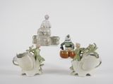 two figurines that are sitting on a table