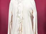 white blouse with ruffles on a mannequin base