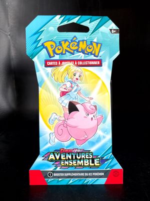 a close up of a box of pokemon cards on a table