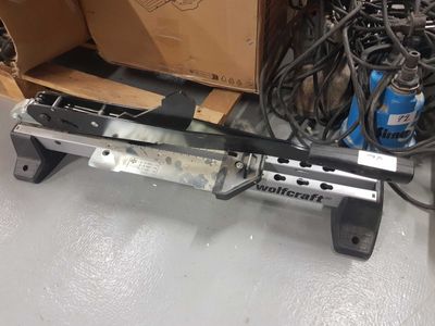 a machine that is sitting on the floor next to a box of wires