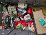 a large amount of food in the back of a truck