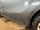 a close up of a car that has been painted gray