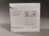 packaging of an apple airpods in a box on a table