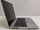 a laptop computer sitting on a table with a white background