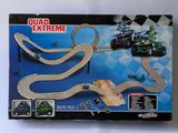 the box of a toy race track with a motorcycle and a car