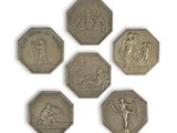 four silver coins with a picture of a man and a woman on them