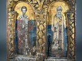 an image of a pair of wooden plaques with religious figures on them