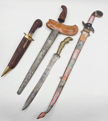 three different types of knifes are displayed on a white surface