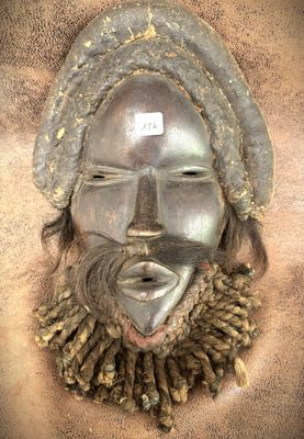 an image of a mask with a beard and a hat on it