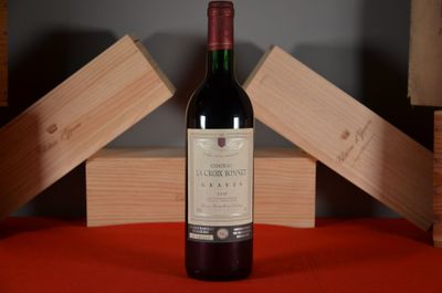 a bottle of wine that is sitting on a table
