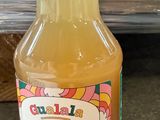 a bottle of orange juice sitting on a counter