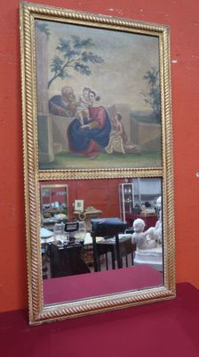 a mirror with a picture of a woman and a man on it