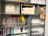many boxes and boxes on a shelf in a room