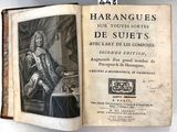 un vieux livre sur lequel figure l'image d'un homme assis sur une chaise