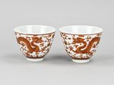 pair of chinese porcelain cups with dragon design