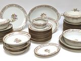a lot of plates and bowls on the table