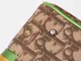 the zipper of a purse with a multicolored stripe on it