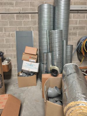 a room with a lot of boxes and a bunch of hoses