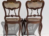 pair of antique french style chairs with cane back and cane backs