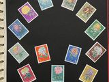 an open notebook with a bunch of stamps on it