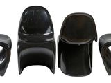 three black plastic chairs sitting next to each other on a white surface