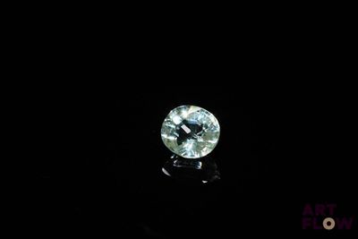a close up of a diamond on a black surface