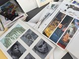 a lot of books on a table with pictures on them