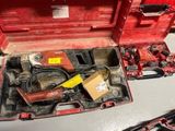 a red tool box with tools in it on a table