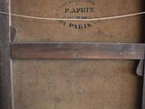 a picture of an old wooden box with a rope hanging from it