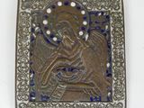 an image of a metal plaque with a picture of an angel on it