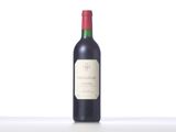 the bottle of red wine is sitting on the table