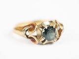 une image représentant une bague en or sertie d'un diamant bleu