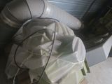 a pile of white bags sitting on top of a pallet