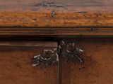 a close up of a wooden cabinet with a lock on it