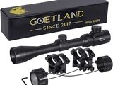 a rifle scope scope with a box and accessories for it