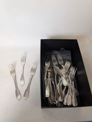 a box of forks and spoons sitting on a table