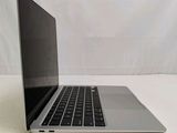 an open laptop computer sitting on top of a white table