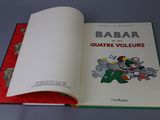 an open book with a picture of a cartoon character on it