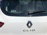 a close up of the rear window of a white car