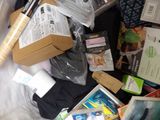 a pile of items sitting on top of a bed