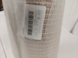 a roll of fabric with a barcode on it on a table