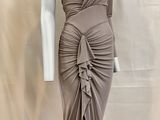 an image of a mannequin wearing a dress on a mannequin stand