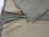 a close up of a person ' s pants with a white shirt