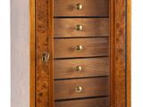an image of a wooden jewelry box with five drawers