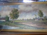 Une peinture à l'huile représentant une scène de vie à la ferme est exposée dans une boutique.