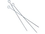 a pair of metal needles sitting next to each other on a white surface