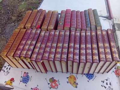 a lot of books that are on a table